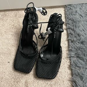 This is a black band new public desire heels